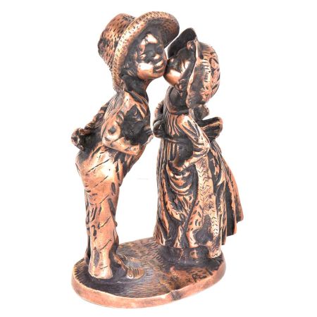 Figurines of a Girl  kissing a Boy