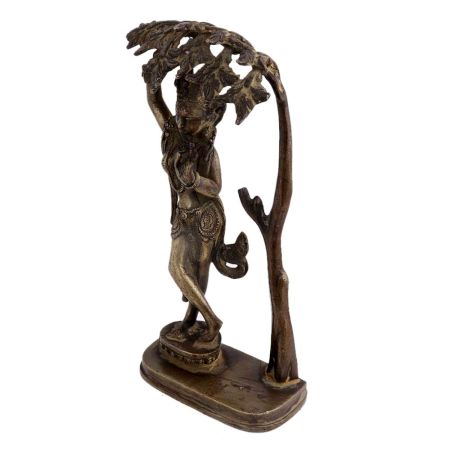 Brass Goddess Statue Under A Tree