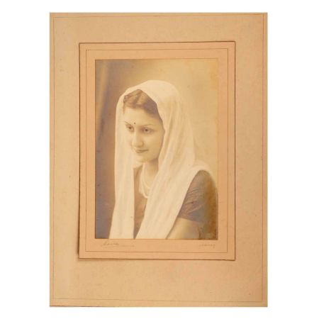 Vintage Paper Photograph of Lady Sitting in Black and White Colour