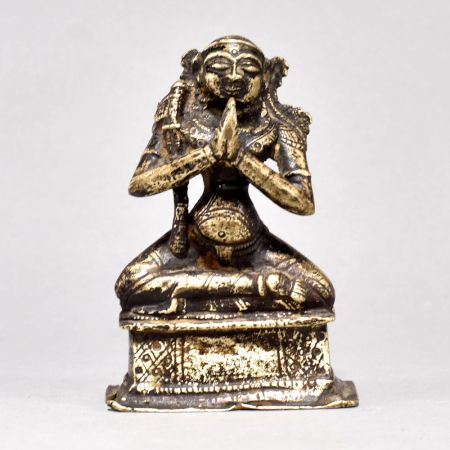 Male God Figure Sitting with Axe