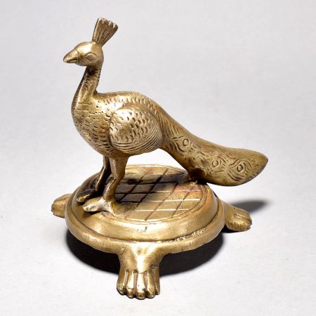 Brass Peacock Figurine on Table
